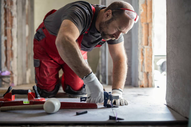 istock Professional tiler fixing newly installed tiles 1372276981
