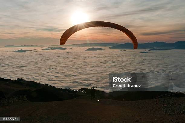 Paraglider Is Taking Off In The Sunset Stock Photo - Download Image Now - European Alps, Extreme Terrain, Flying