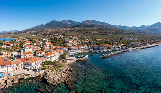 Greece Peloponnese. Mani, Agios Nikolaos traditional fishing village and port, aerial drone view. Coastline and water bay. Messenia summer destination