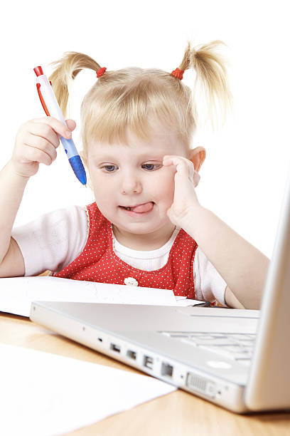 child and laptop stock photo