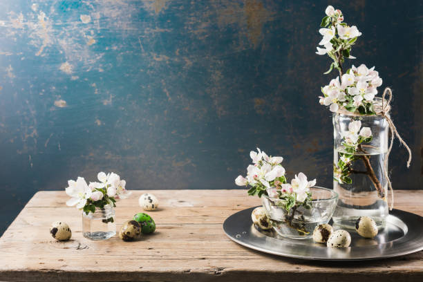 istock Branches of a blossoming apple tree and quail eggs. 1372280942