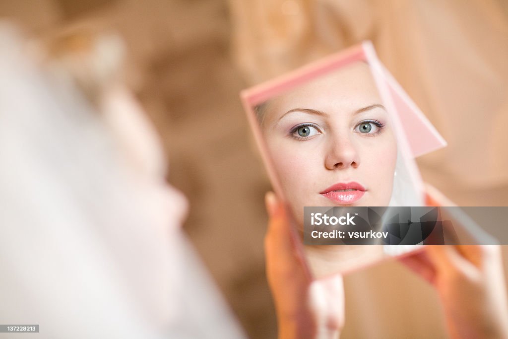 in the mirror face of the girl in the mirror Adult Stock Photo