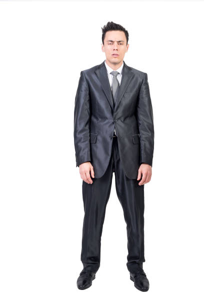 istock Half asleep businessman in studio. White background. 1372283370