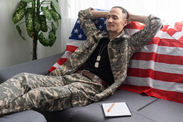 istock Young American soldier sitting and taking notes. 1372285534