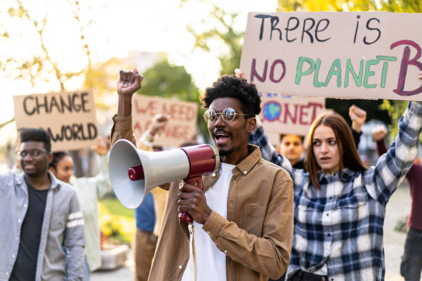 istock Group of demonstrators from different cultures and race fight for climate change 1372286417