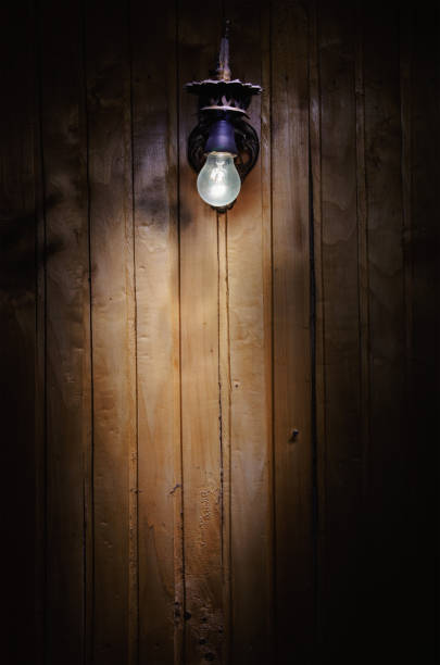 istock Light Bulb on Wooden Wall 1372286998