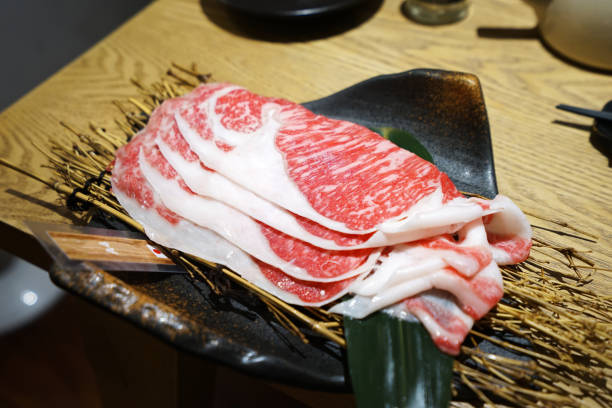 istock Close up Sliced Wagyu beef on black plate 1372288352