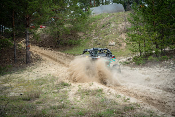 istock Professional quad biker rides fast on sand. Quad racing, ATV 4x4 1372290393