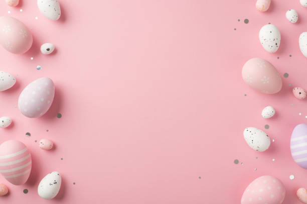 istock Top view photo of easter decorations shiny confetti violet pink and white easter eggs on isolated pastel pink background with copyspace 1372291579