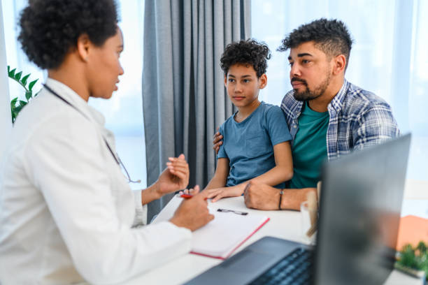 istock Black boy having a medical exam at doctor's office 1372292821