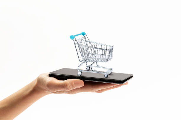 istock shopping car on smartphone on white background 1372294992