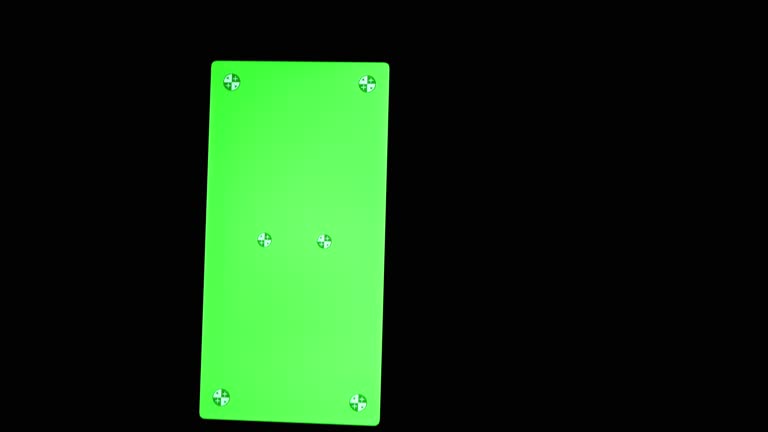 Smartphone with Green Screen, Chroma Key, Markers on Black Background. Close up