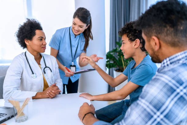 istock Black boy having a medical exam at doctor's office 1372298251