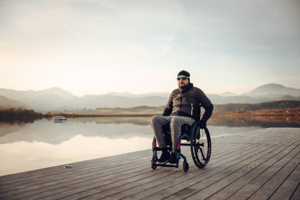 istock Disabled man in wheelchair admiring nature 1372302291