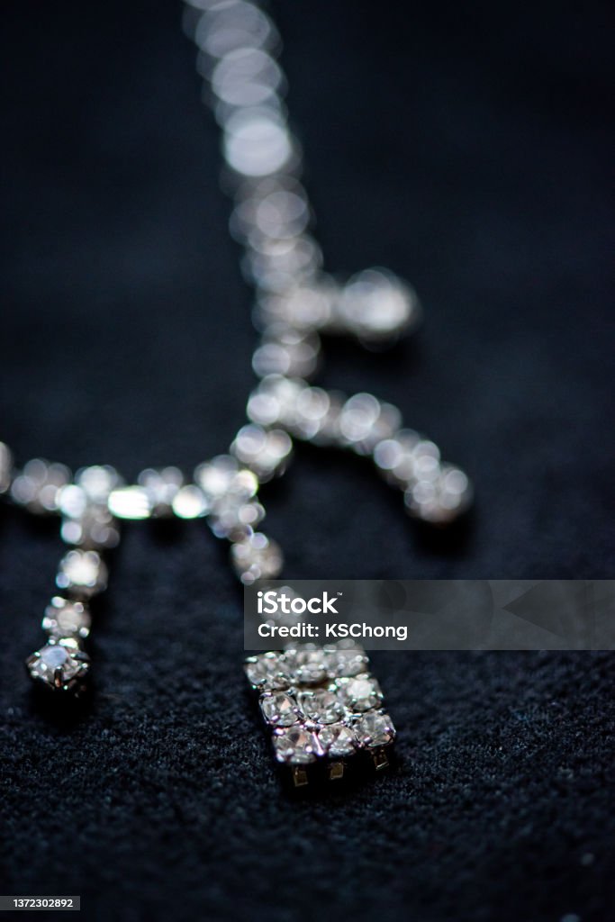 Diamond necklace on a black background Close-up of diamond necklace on a black background. Jewelry Stock Photo