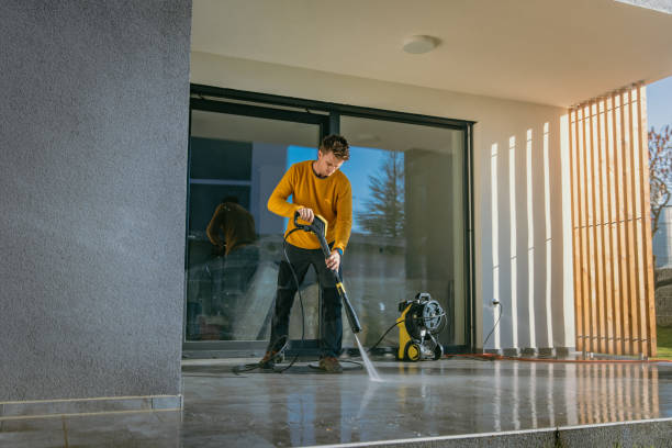 istock Man cleaning the patio with high pressure cleaner 1372306590