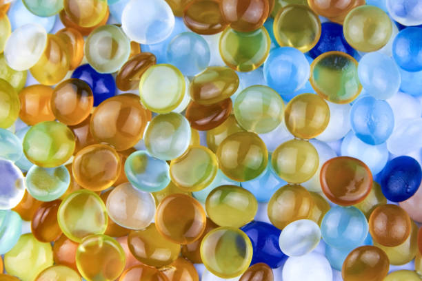 Multi-colored glass stones polished by the sea, backdrop.