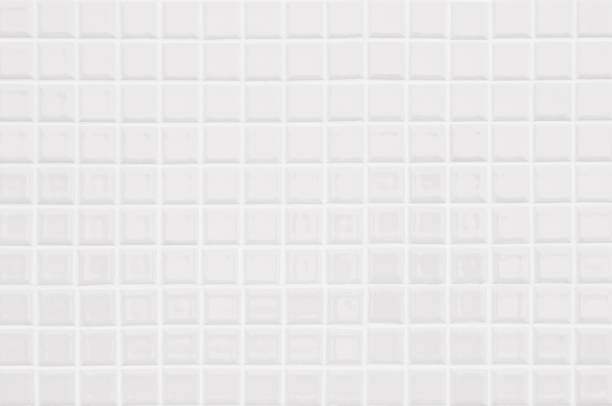 istock White or gray ceramic wall and floor tiles abstract background. Design geometric mosaic texture decoration of the bedroom. Simple seamless pattern for backdrop hospital wall, canteen and grid paper. 1372309826
