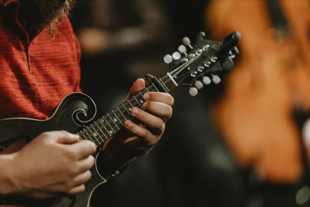 istock Midsection Of Man Playing Guitar 1372313723