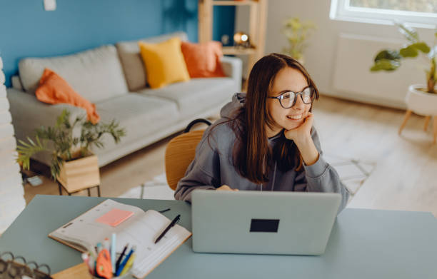 Teenager have online school at home stock photo