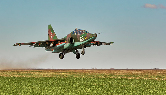 Su25 frogfoot attack aircraft close up in the sky with clouds. During an exercise in the Republic of Belarus.