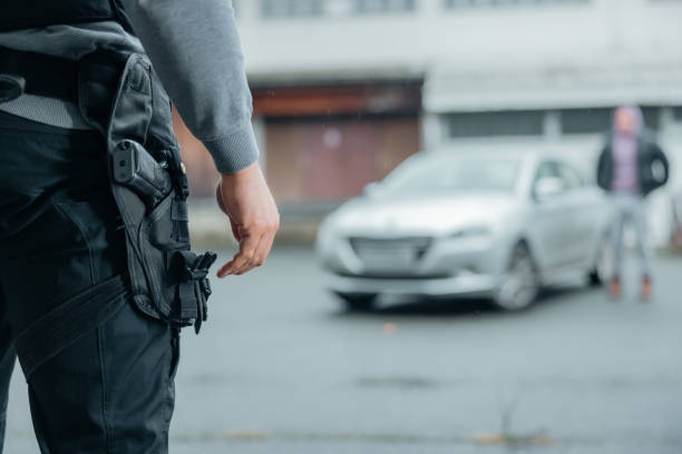 istock Policeman warning a suspect in the distance 1372319842