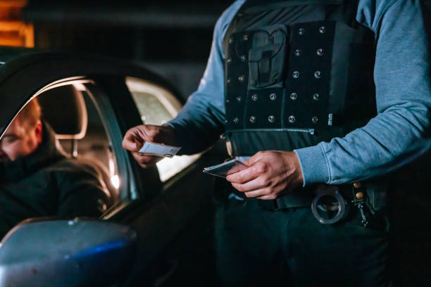 istock Traffic cop taking a bribe from the stopped driver 1372319928