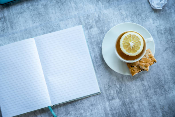istock notepad and cup of tea, freelance work. home office, education or writing concept 1372320665