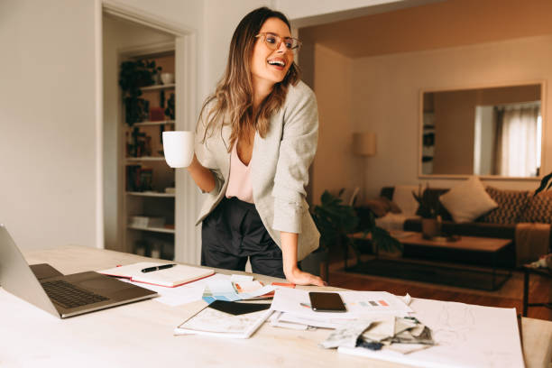 Design professional taking a coffee break in her home office