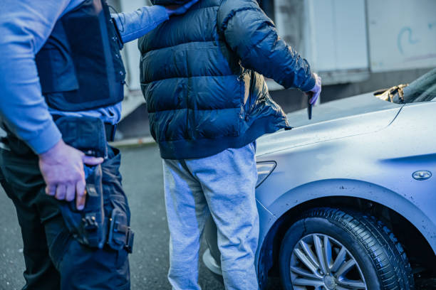 istock Policeman carefully investigating a suspect 1372320828