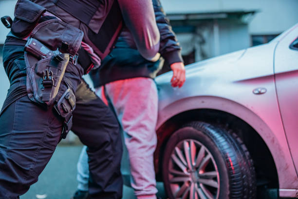 istock Police officer using force to investigate a suspect 1372320943
