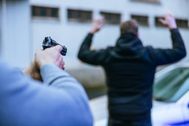 Robber with gun at night