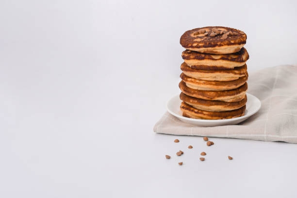 istock A stack of pancakes on a white plate. on a white background. empty space 1372321257