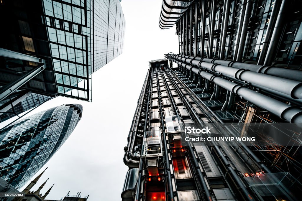 Looking directly up at the skyline of the financial district in central London Lloyds of London Stock Photo