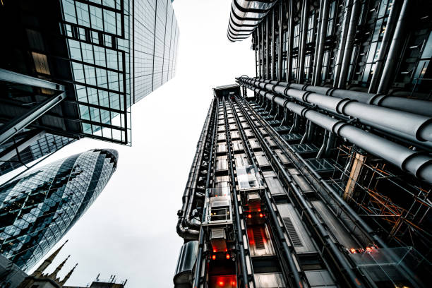 Looking directly up at the skyline of the financial district in central London Looking directly up at the skyline of the financial district in central London lloyds of london photos stock pictures, royalty-free photos & images