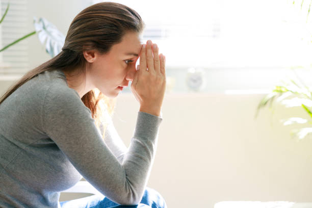 istock Upset young woman sitting on couch alone at home 1372322213