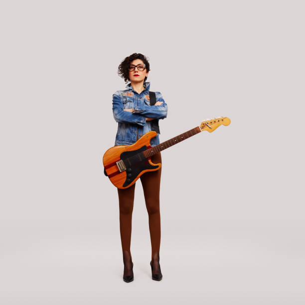 istock Let's Rock. Rock star standing with guitar 1372322661