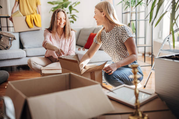 istock Young women unpacking in new home 1372322699