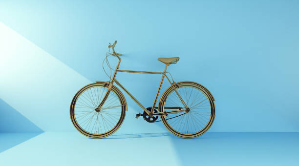 istock golden bicycle on a blue background side view 1372323442