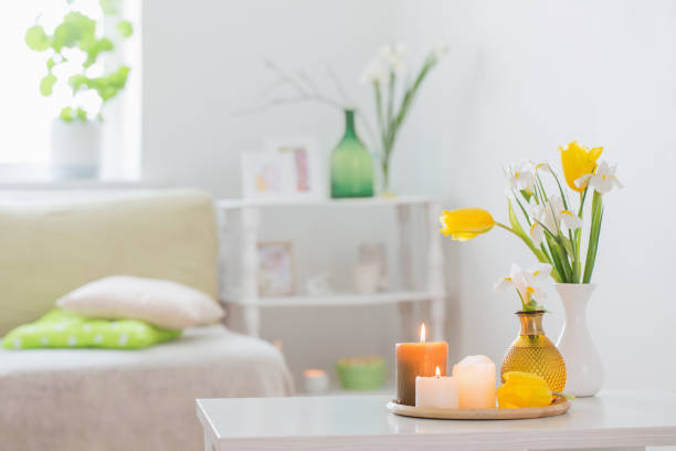 white home interior with spring flowers and decorations - vehicle interior green sofa indoors imagens e fotografias de stock