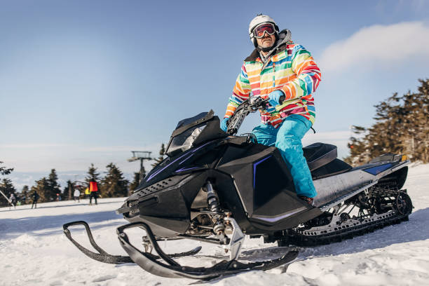 istock Man driving a snowmobile 1372327050