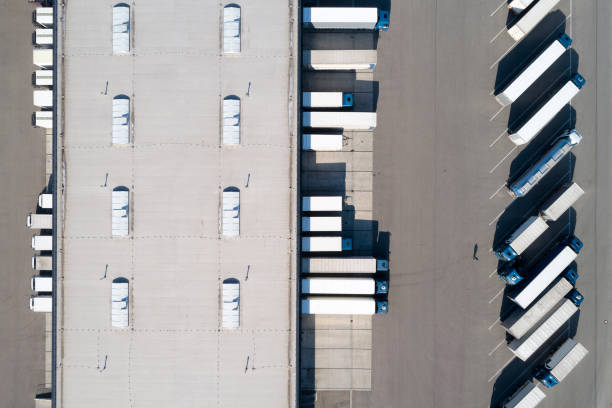 istock Distribution Warehouse and Trucks from Above 1372327192