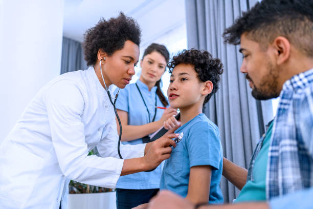 istock Black boy having a medical exam at doctor's office 1372327809
