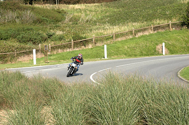 istock Motorcyclist speeding around Hairpin bend 137232922