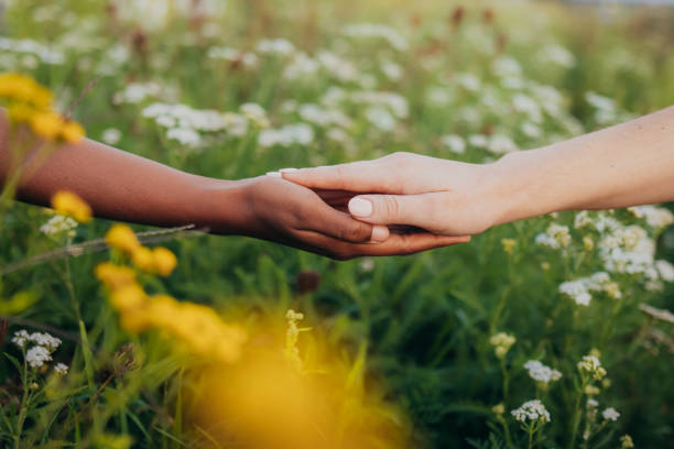 istock Multi-ethnic female couple holding hands 1372330337