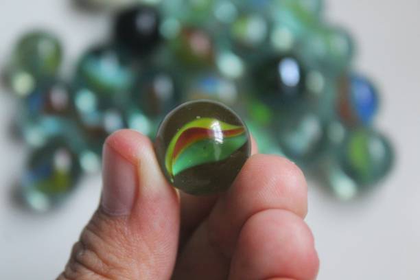 istock a marble in someone's hand 1372330360