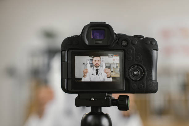 istock Medical worker talking about pills while filming video blog 1372330791
