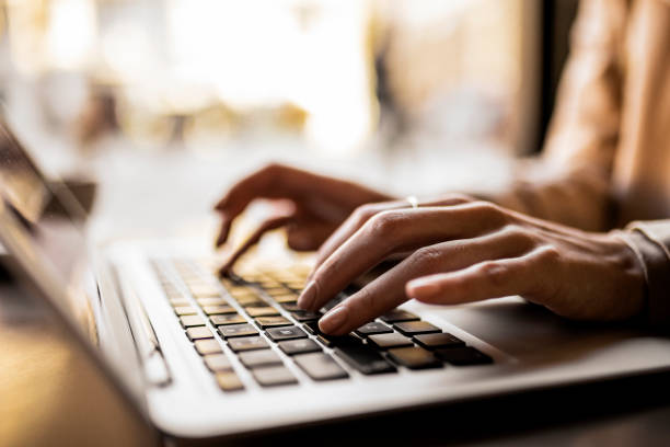 istock Girl typing on her laptop 1372333272