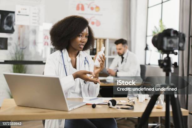 Doctor Tutorial African Doctor Recording Video Tutorial About Medications Stock Photo ...