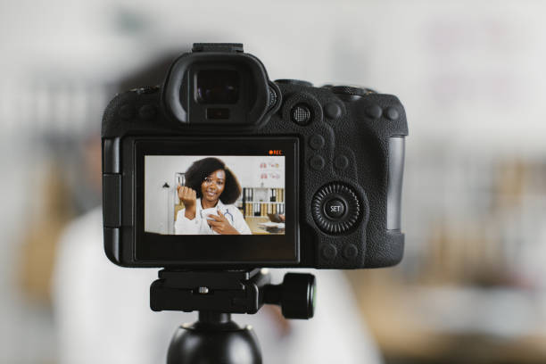 istock Doctor showing how to use electronic thermometer in vlog 1372333684